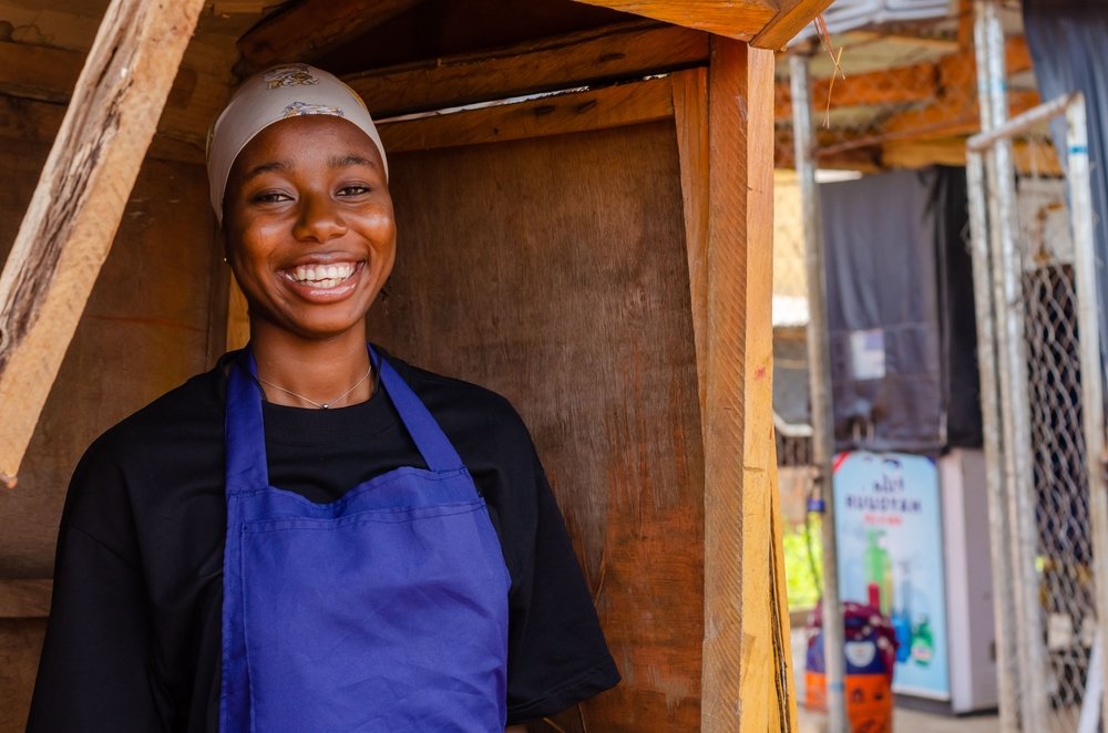 African,Lady,In,A,Kiosk,Smiling